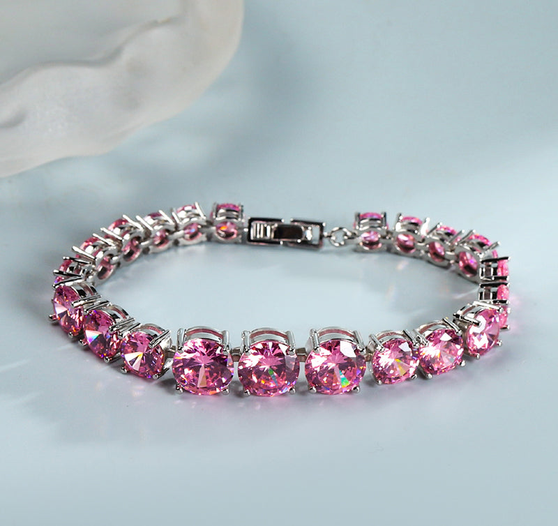 Pink round gemstone tennis bracelet, full row of cut gemstones, four-prong silver base, romantic and sweet.
