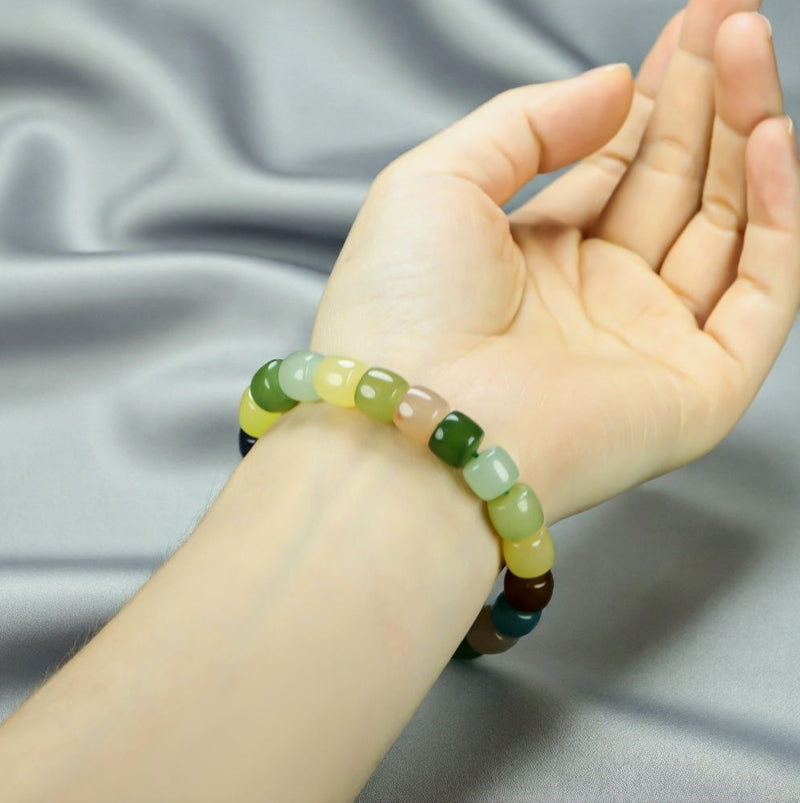 Colorful Jade Barrel Bead Elastic Bracelet - Harmonious mix of yellow, green, mint, emerald green, lake blue, deep blue, milky white, and brown, fresh and elegant.