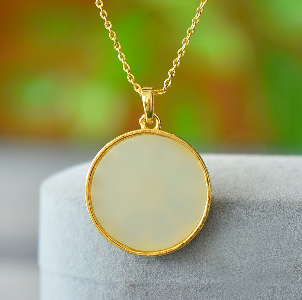 Round Dharma Wheel Necklace with Eight-Petaled Flower Hetian Jade Constructed with white jade segments separated by golden spokes