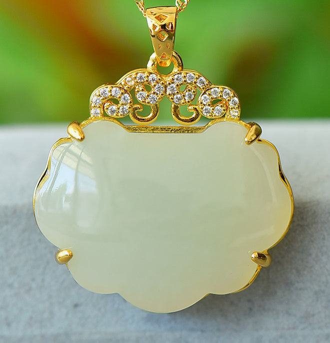 Hetian jade pendant necklace with gold auspicious cloud inlay – Hetian jade is warm, elegant, and symbolizes good fortune and wealth.  Comes with a beautiful gift box