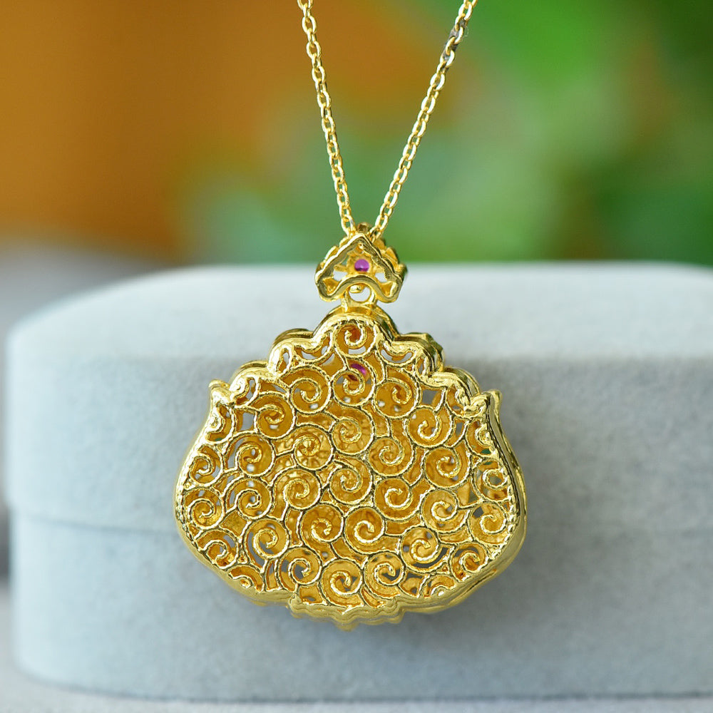 18K Gold Necklace Featuring a Hetian Jade Pendant Set in an Openwork Frame with Auspicious Cloud and Scroll Patterns, Accented with Rubies