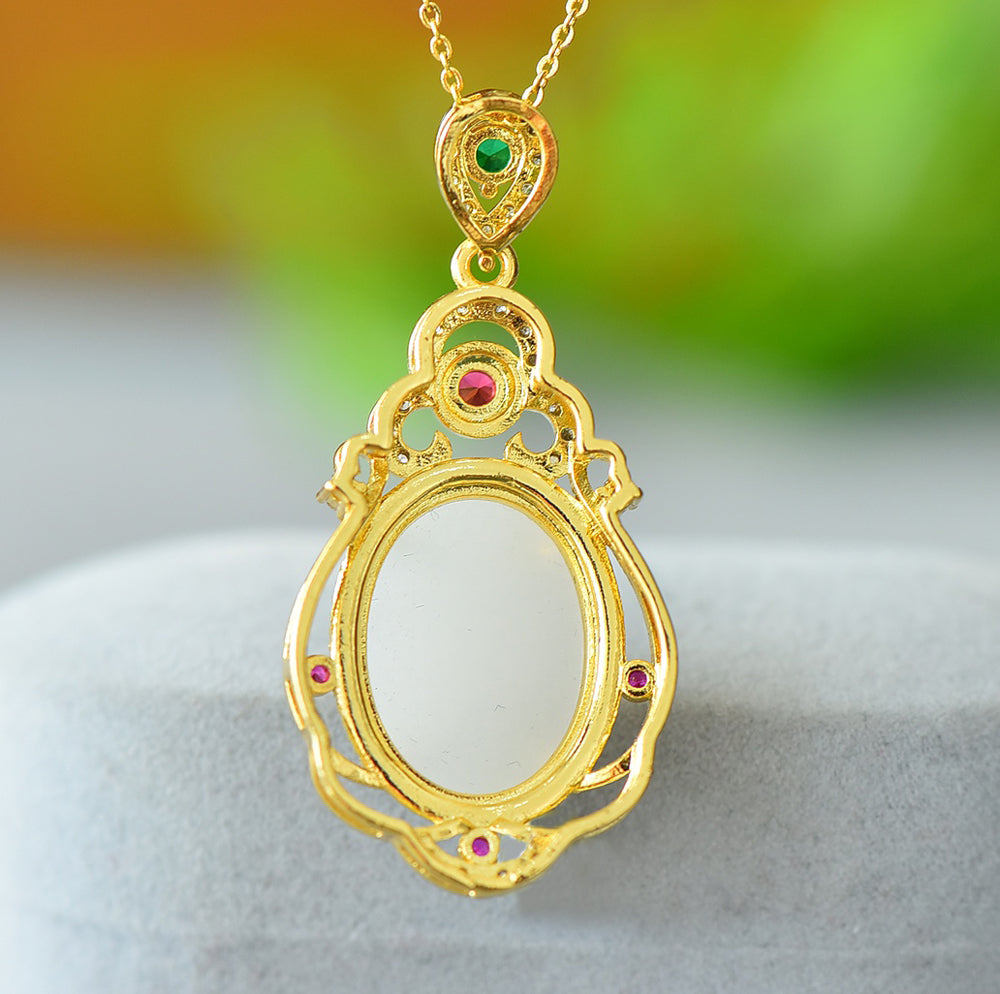 Hetian jade gold openwork teardrop-shaped necklace – rich layers of milky white Hetian jade, rubies, and emeralds, exuding a royal aura.