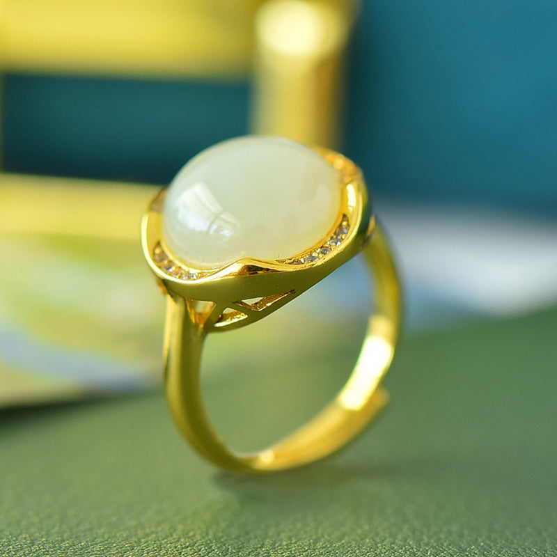Hetian jade round cabochon ring with gold twisted setting – Hetian jade is warm, elegant, simple, and sophisticated, suitable for everyday wear
