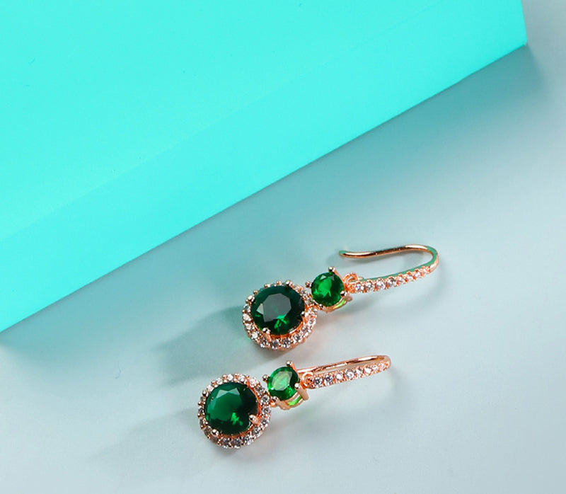 Emerald double crystal rose gold earrings, studs and drops, set with white vanadium, come in a beautiful gift box.