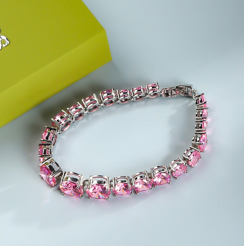 Pink round gemstone tennis bracelet, full row of cut gemstones, four-prong silver base, romantic and sweet.