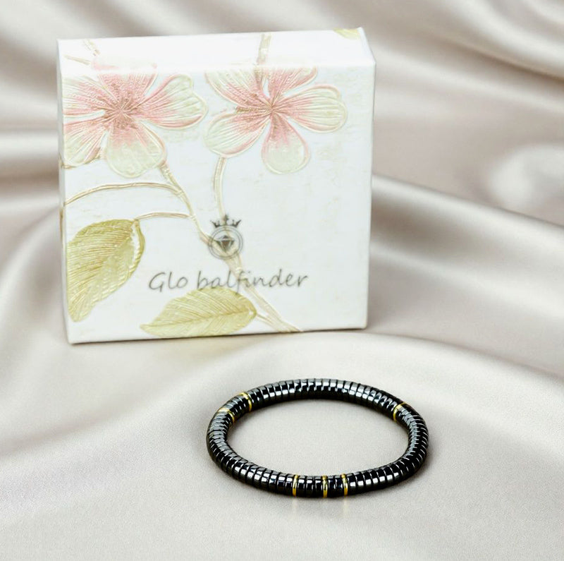 Black Terahertz Bead and Gold Spacer Elastic Bracelet – A stylish, minimalist, unisex magnetic therapy accessory featuring a striking gold-and-black contrast.