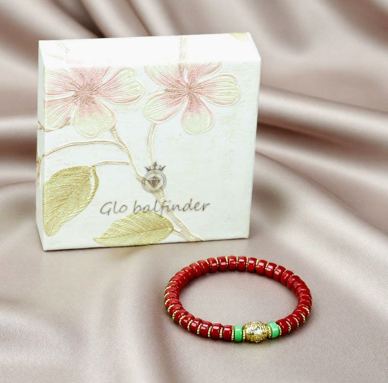 Red coral pill beads, gold serrated spacer bracelet, turquoise,  gold barrel beads, festive and opulent Tibetan style.