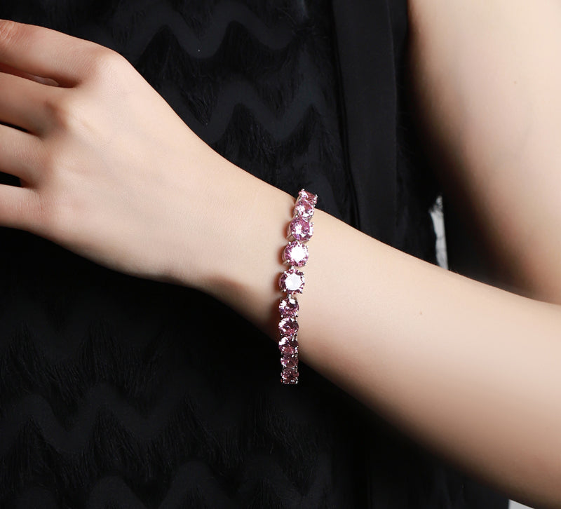 Pink round gemstone tennis bracelet, full row of cut gemstones, four-prong silver base, romantic and sweet.