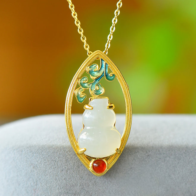 Hetian jade gourd pendant with enamel-painted auspicious clouds and ruby base - exquisitely carved gourd symbolizing good fortune and prosperity.