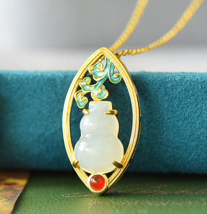 Hetian jade gourd pendant with enamel-painted auspicious clouds and ruby base - exquisitely carved gourd symbolizing good fortune and prosperity.