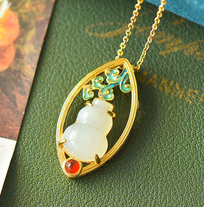 Hetian jade gourd pendant with enamel-painted auspicious clouds and ruby base - exquisitely carved gourd symbolizing good fortune and prosperity.