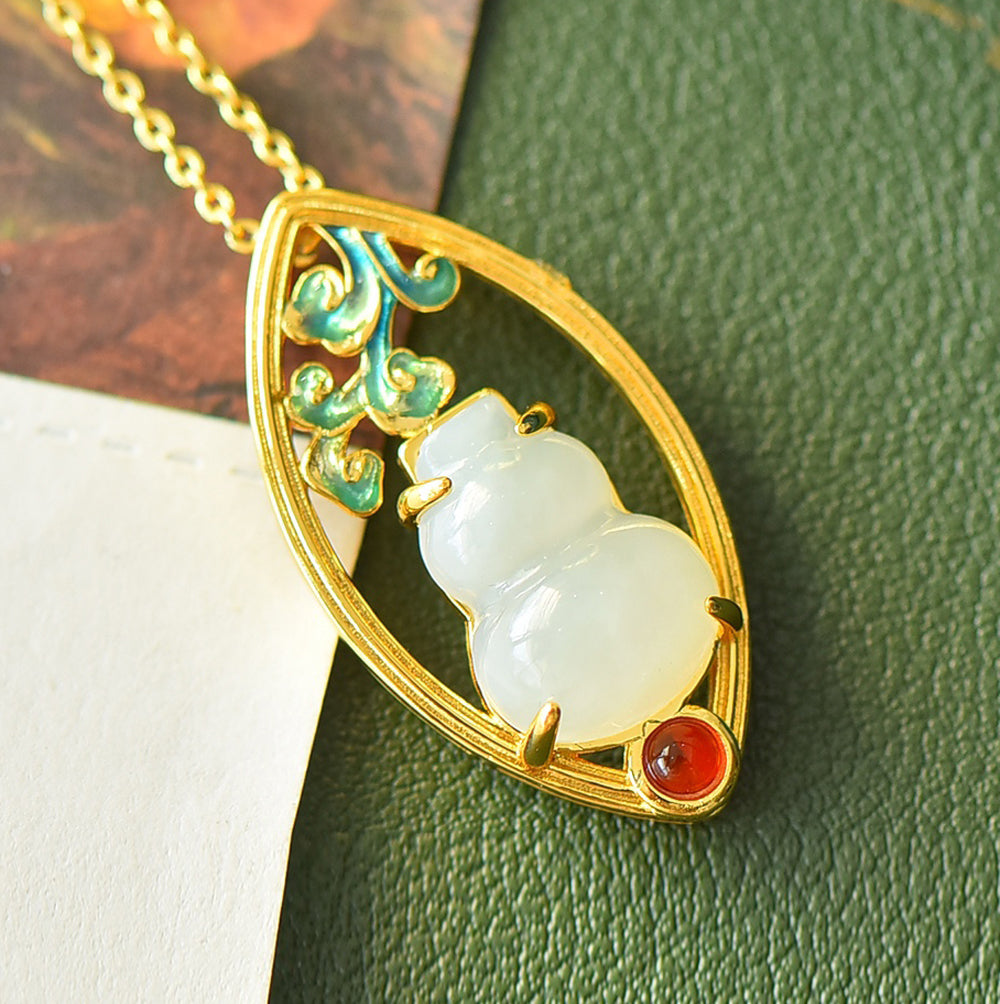 Hetian jade gourd pendant with enamel-painted auspicious clouds and ruby base - exquisitely carved gourd symbolizing good fortune and prosperity.