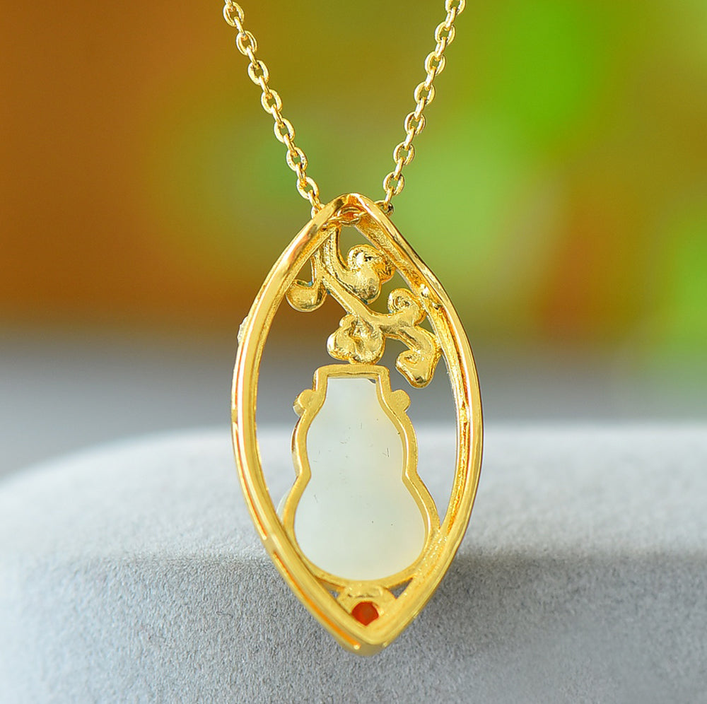 Hetian jade gourd pendant with enamel-painted auspicious clouds and ruby base - exquisitely carved gourd symbolizing good fortune and prosperity.